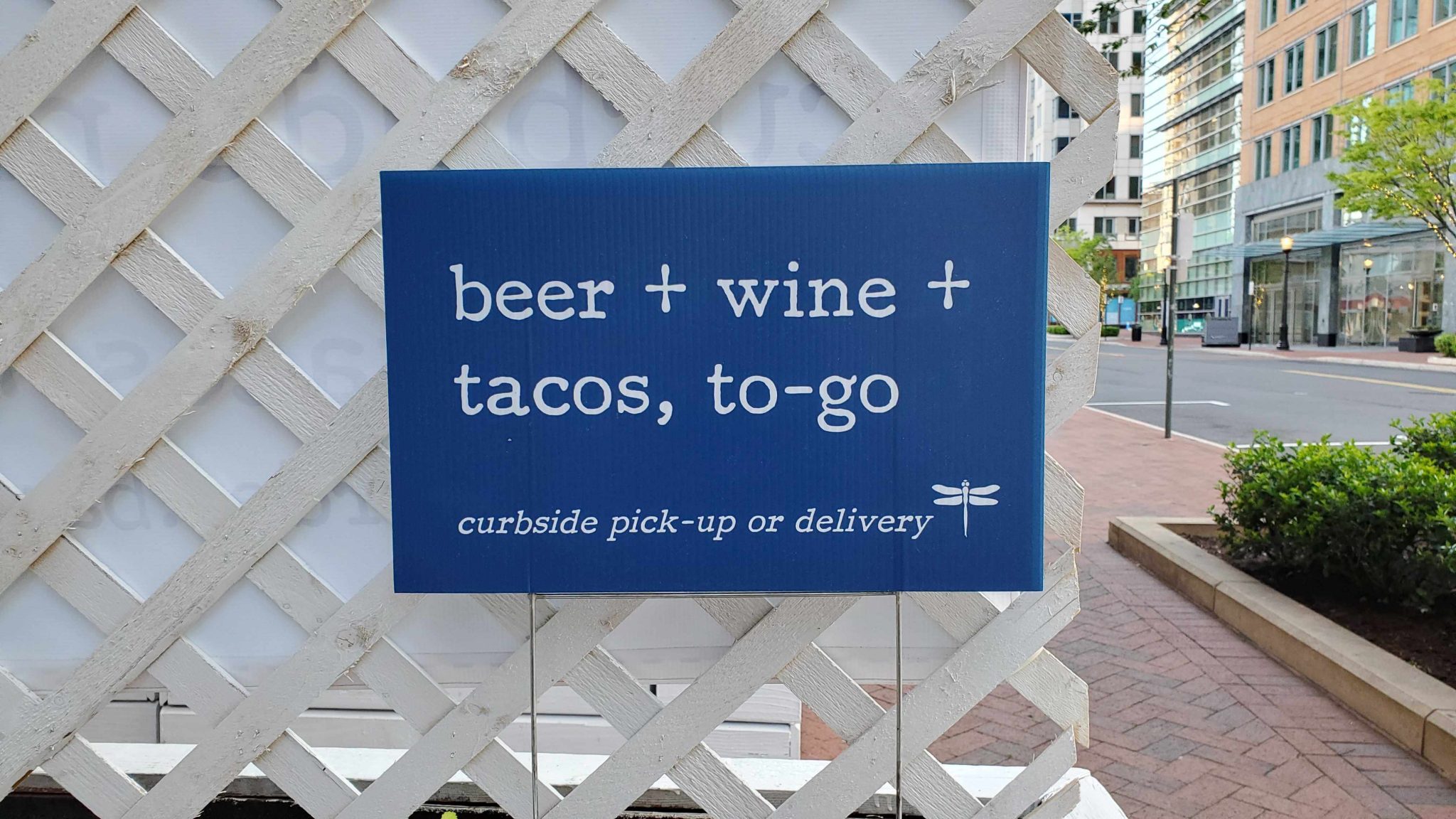 Restaurant signage directs customers on where to go for curbside pick up or delivery during COVID-19 when dining areas must remain closed.